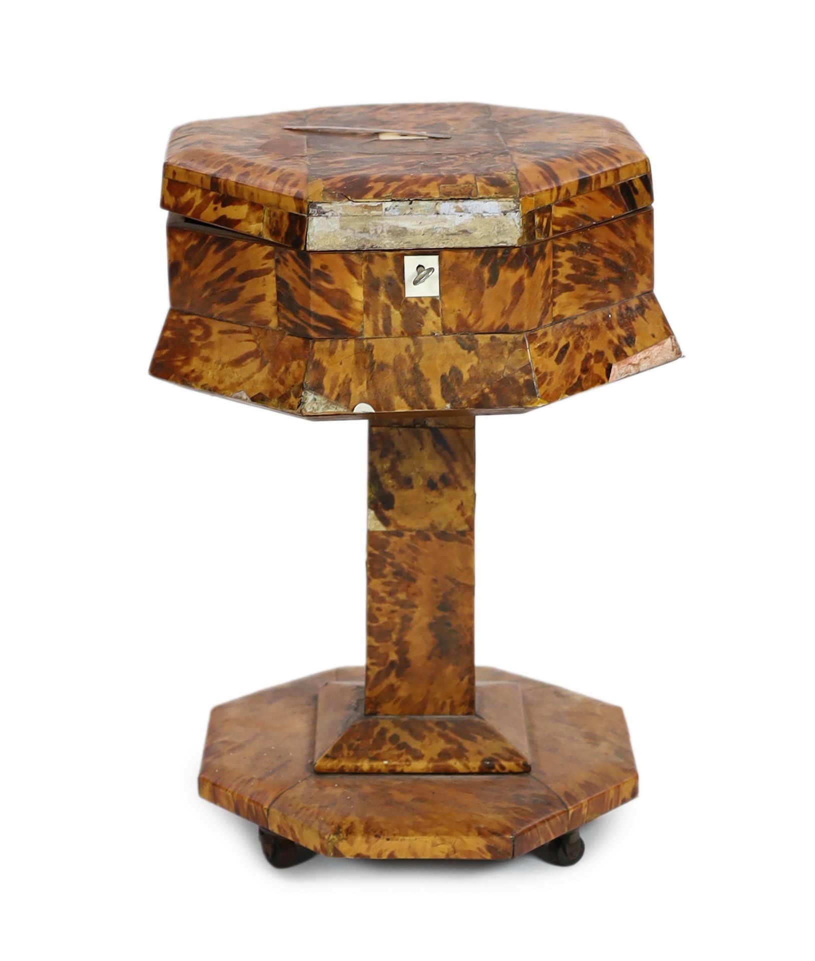 A mid 19th century tortoiseshell veneered pedestal work table, 48cm high 34cm diameter